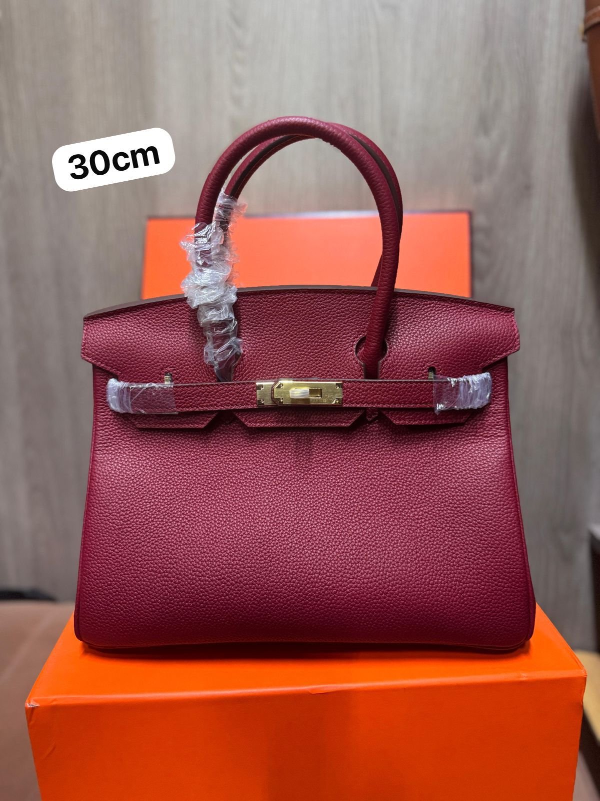 Hermès Birkin 30 bag with gold hardware.