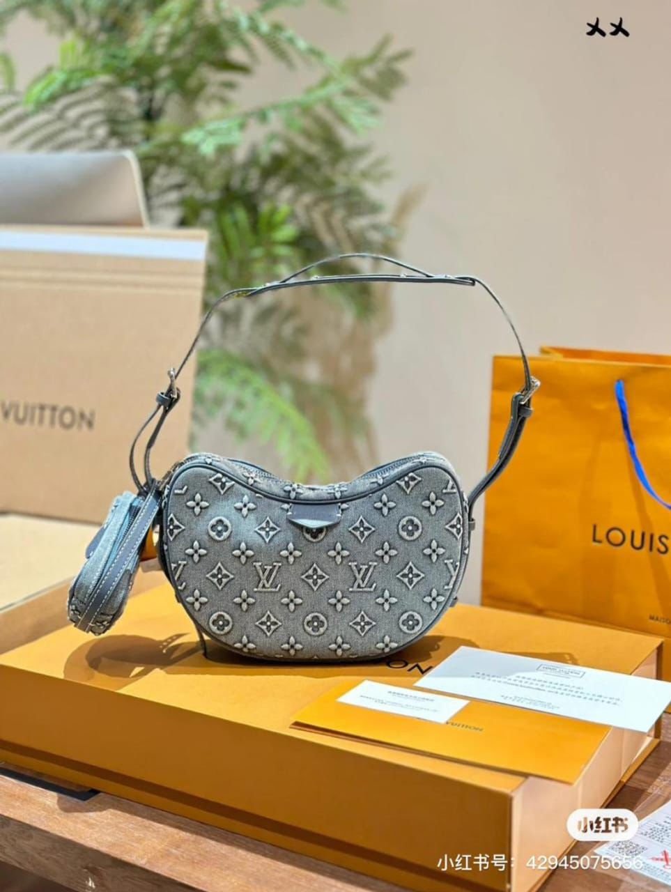 Louis Vuitton Looping handbag is crafted from signature Monogram denim canvas.